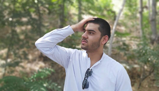 Live Your Best Life by Choosing to Feel It Out, Not Figure It Out a man with his hand on his head looking into the distance