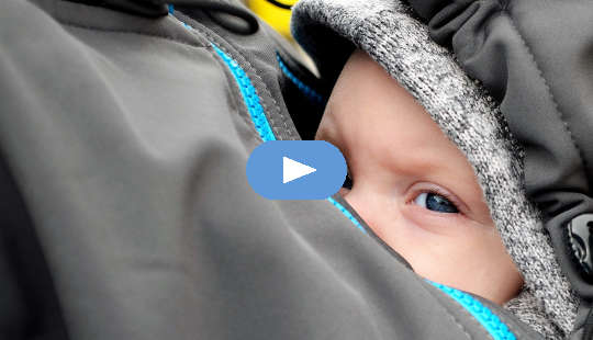 What If Your Life Purpose Is Simply Love and Joy? a baby sheltered inside his mother's jacket on her breast