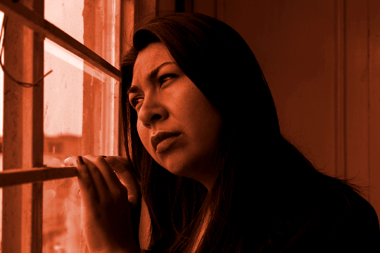 Something We All Have in Common: Mothers a woman looking out a window