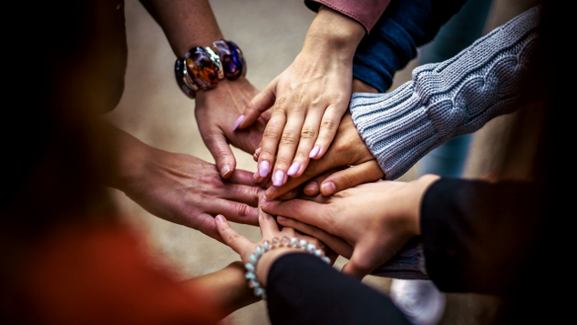 Getting Ready for Miracle Relationships numerous hands in a circle, touching