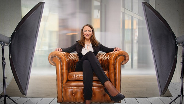 To Land A New Job, Try This Confidence Boost young woman sitting comfortably and confidently in an arm chair