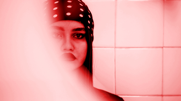 Being Authentically Yourself -- Out Loud a young woman in the mirror - half of her face hidden in vapor