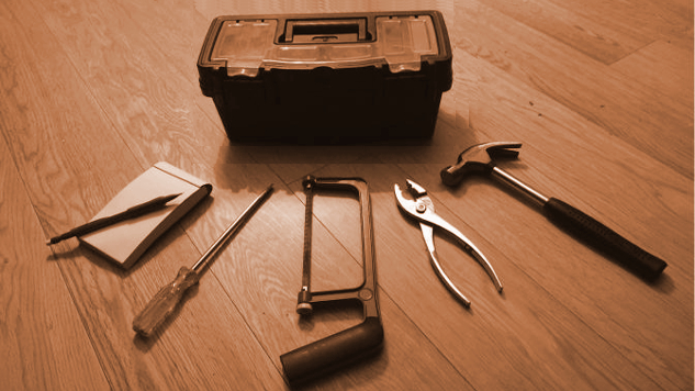 Our Inborn Toolkit of Five Emotions and their Homeopathic Remedies tookbox with 5 tools spread out around it: notepad, screwdriver, hacksaw, pliers, hammer