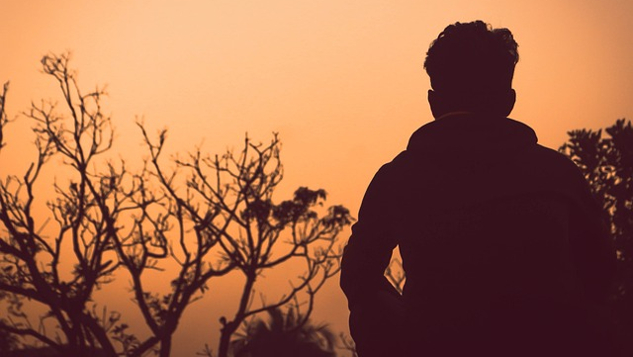Shaken to Our Core: Was It The End of the World? man standing alone outside at sunset