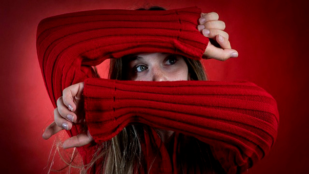 How to Manage Anxiety Naturally and Without Drugs young woman with her arms over her face