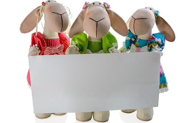Don't Define Yourself with a Label soft toys holding up a blank label