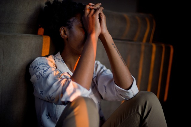 When Emotions Do -- or Don’t -- Flow Smoothly a person sitting on the floor against the wall