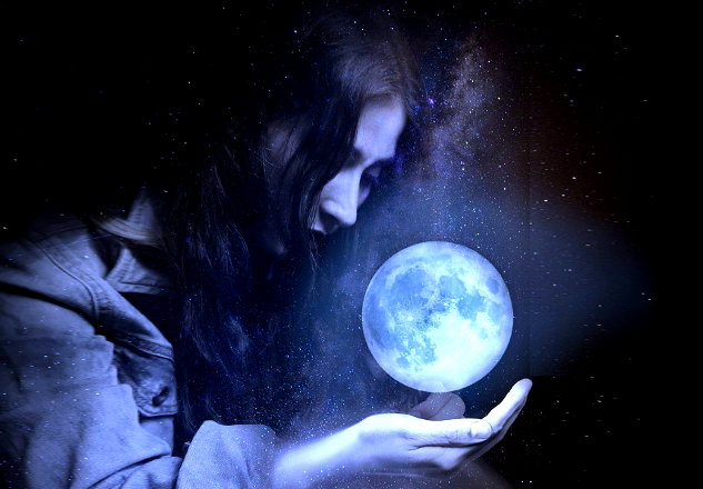 Becoming the Best Version of Yourself a woman holding the shining glove of Earth in her palm