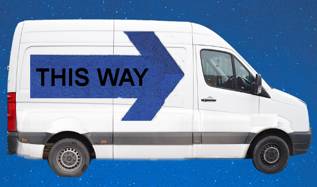 Guidance from Unseen Angels a white van with a huge sign on its side: This Way