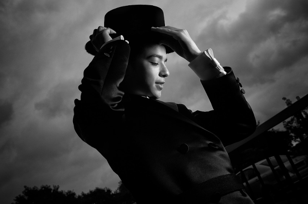 How Being Authentic Helps You Be A Better You a peprson putting on a top hat