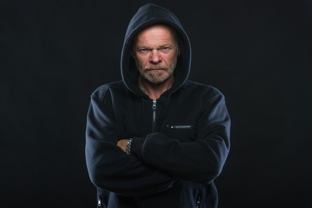 Can Your Relationships Be Making You Sick? a stern looking man with his arms crossed