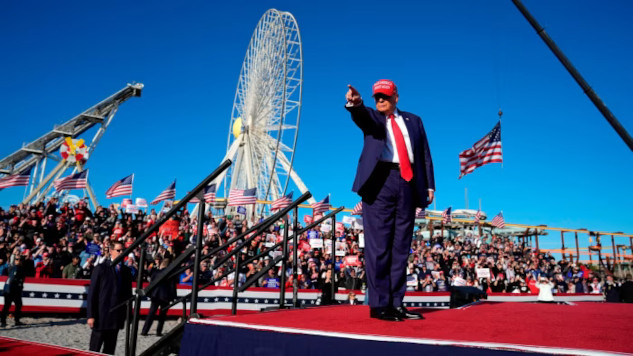 How the Rise of Authoritarianism Fuels Bigotry in Politics An image of Trump addressing crowds, symbolizing the rise of authoritarianism fueled by bigotry and racism.