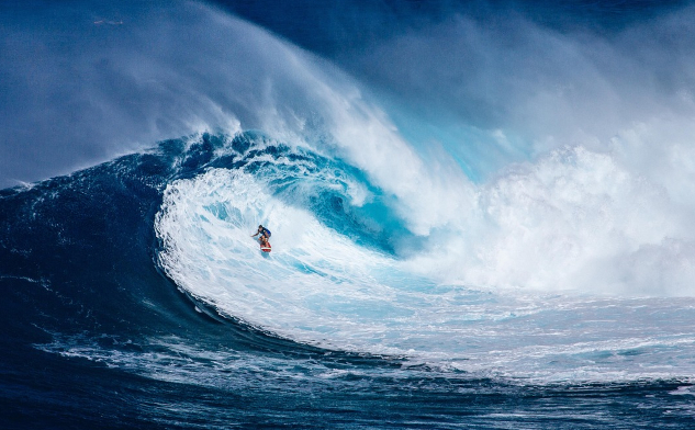 A surfer in the middle of a huge wave. Image by Pexels from Pixabay.&nbsp;