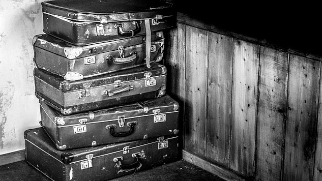 A stack of old suitcases. Image by Rudy and Peter Skitterians from Pixabay.